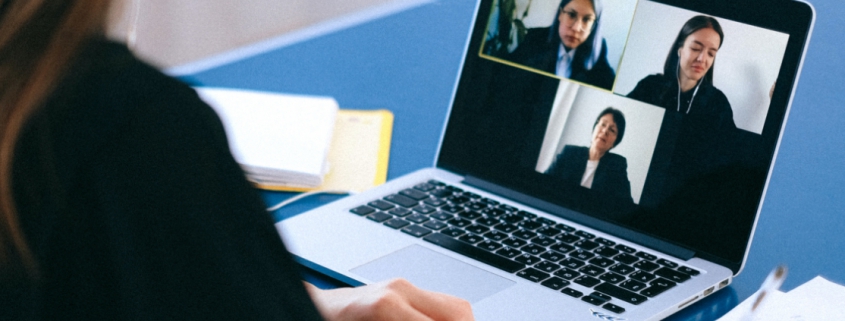 women attend a virtual meeting